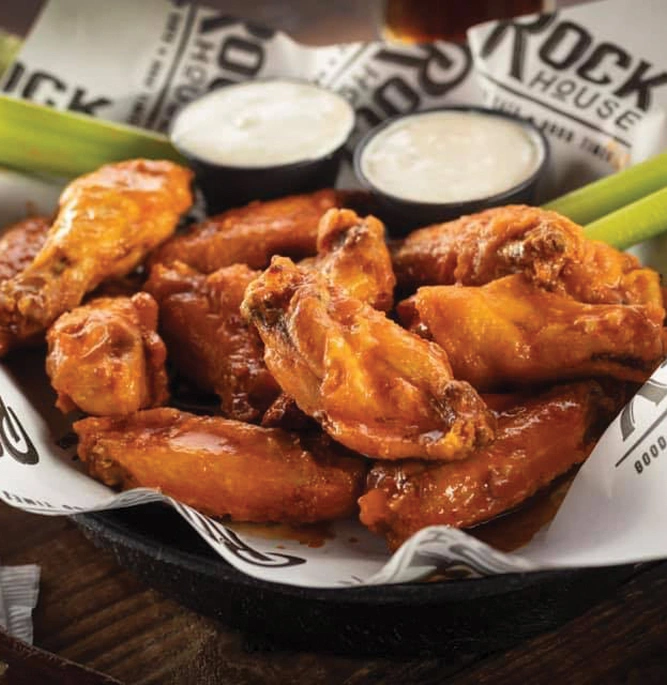 Hot Wings with dipping sauce and celery